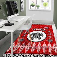 Red Tonga area rug with large white oval design and bold red geometric stripe pattern