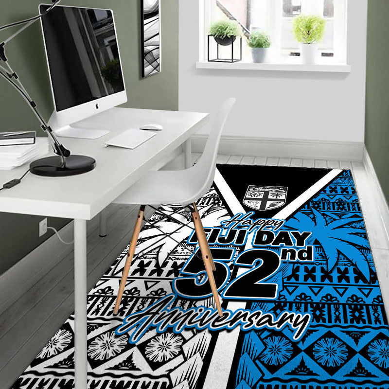 Area rug with "Happy Fiji Day 52nd Anniversary" text and blue "52" on tribal print