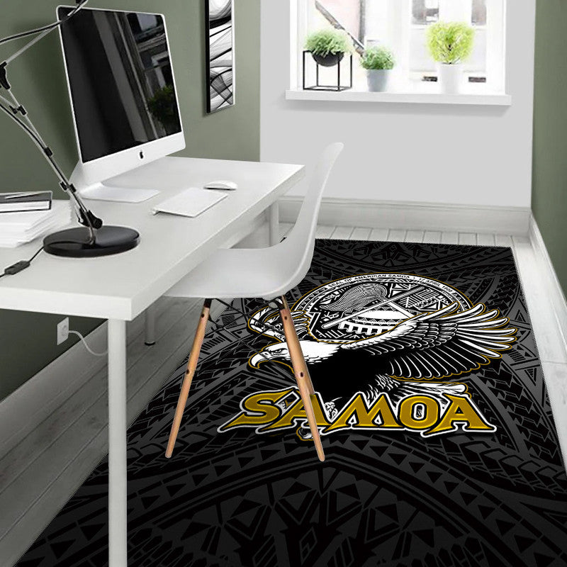 Black floor rug with winged bird emblem and 'SAMOA' lettering, tribal geometry