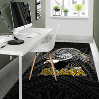 Black floor rug with winged bird emblem and 'SAMOA' lettering, tribal geometry