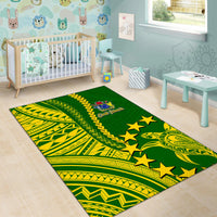 Green Polynesian area rug with yellow tribal graphics, stars, and crest label