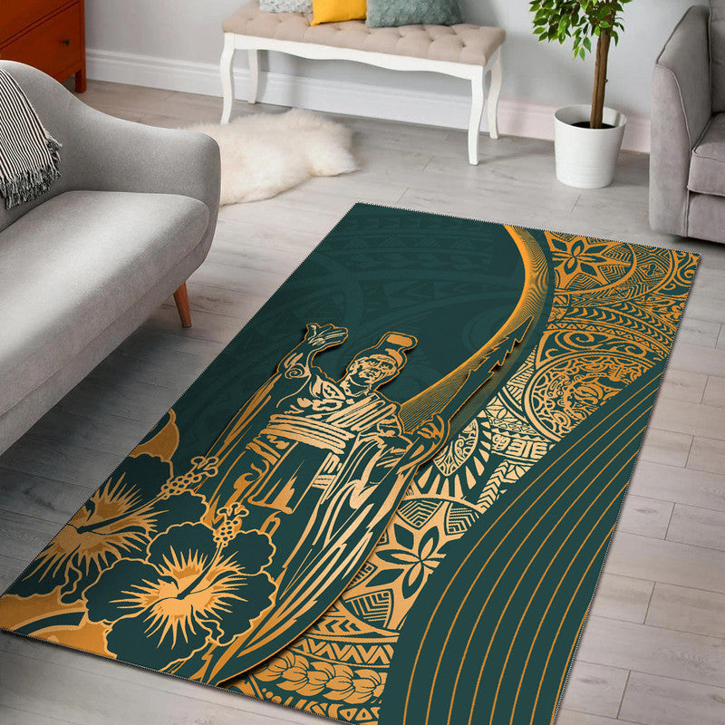 Green area rug with gold Hawaiian-style geometric pattern and floral detailing