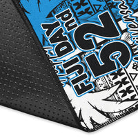 Rug corner detail with black textured backing and blue/white "Happy Fiji Day 52" print