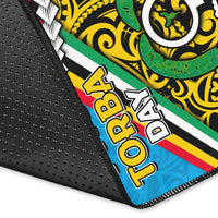 Rug corner close-up: multicolor PNG Torba Day graphic with black textured border edge.