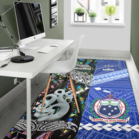 Multicolor Polynesian area rug with Aotearoa and Samoa graphics under dining table
