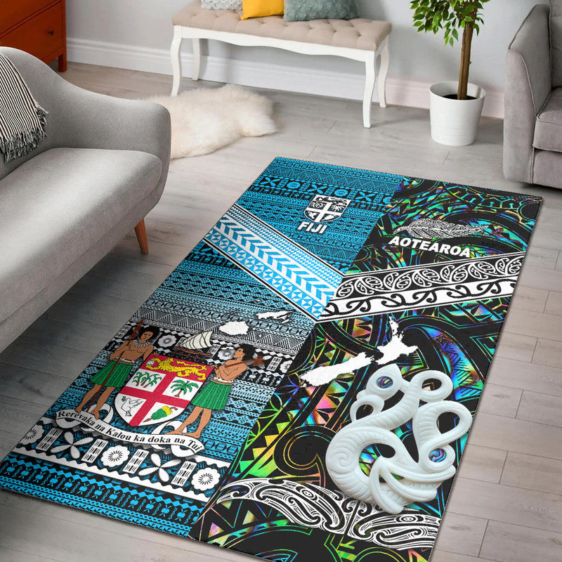 Turquoise and black patterned area rug with white octopus motif and tribal blocks