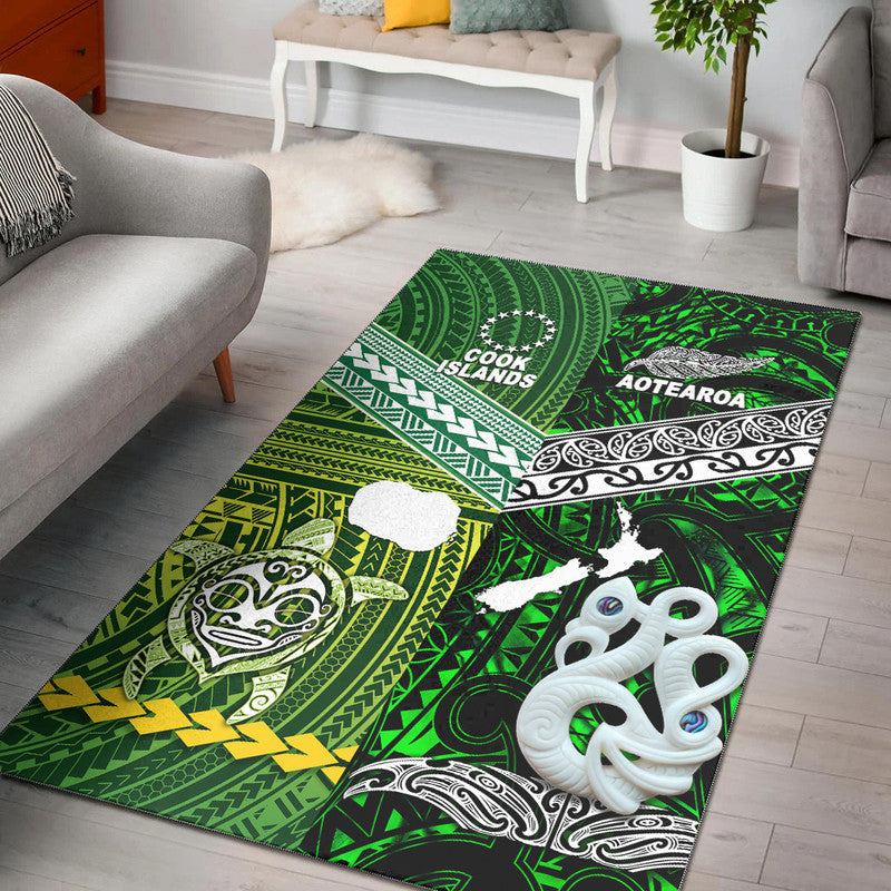 Green area rug with Polynesian-inspired tribal patterns, white animal graphics and text