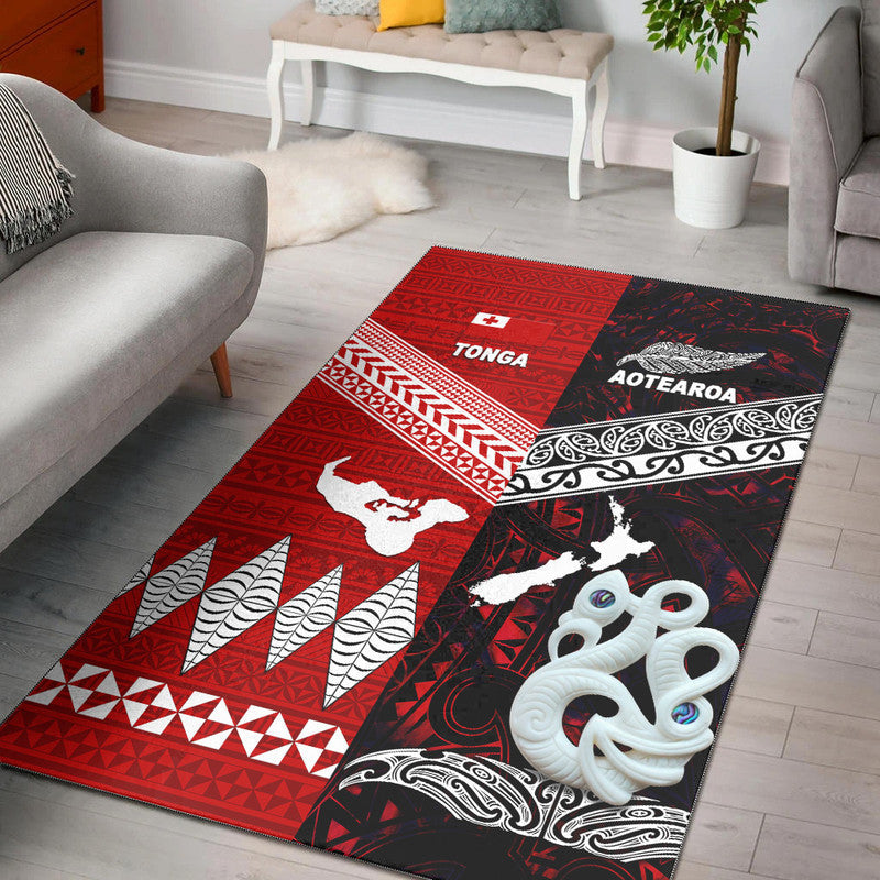 Red and black area rug with tribal patterns, white animal silhouettes, and geometric borders