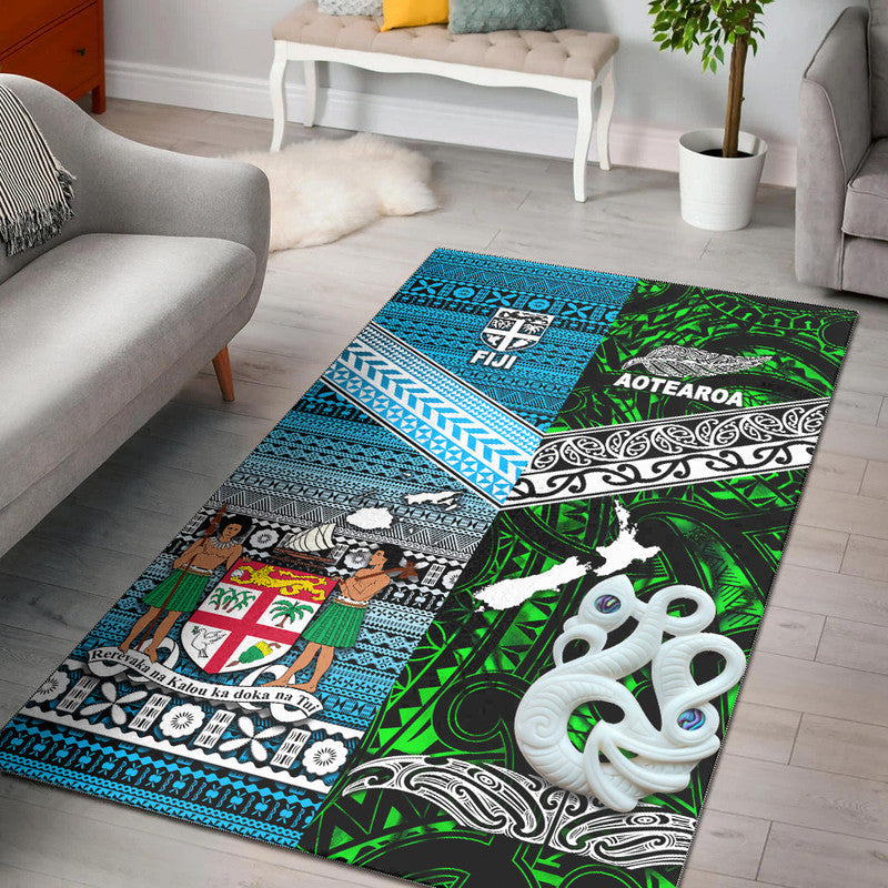 Green, blue tribal map-pattern area rug with Fiji and Aotearoa text, octopus motif