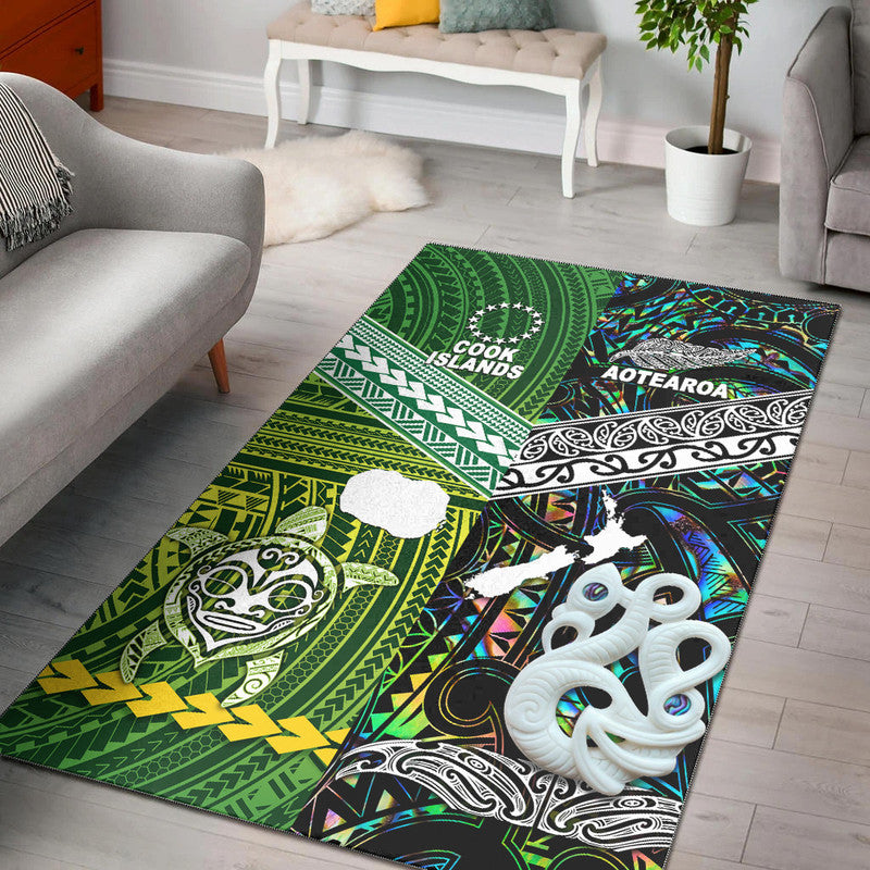 Green area rug with Cook Islands and Aotearoa text, tribal patterns, and white shell design
