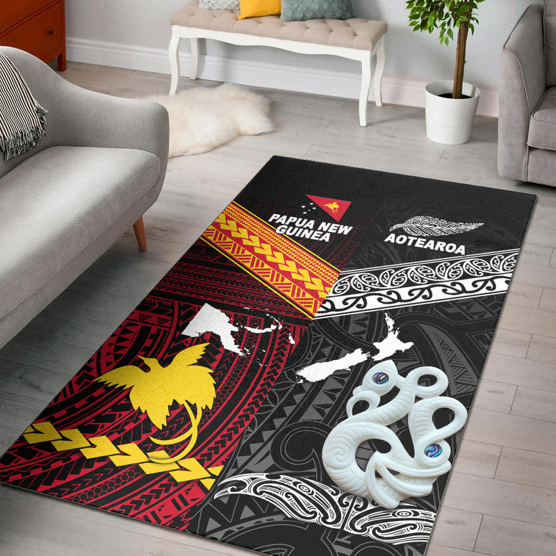 Black area rug with Papua New Guinea and Aotearoa tribal map graphics, white accents