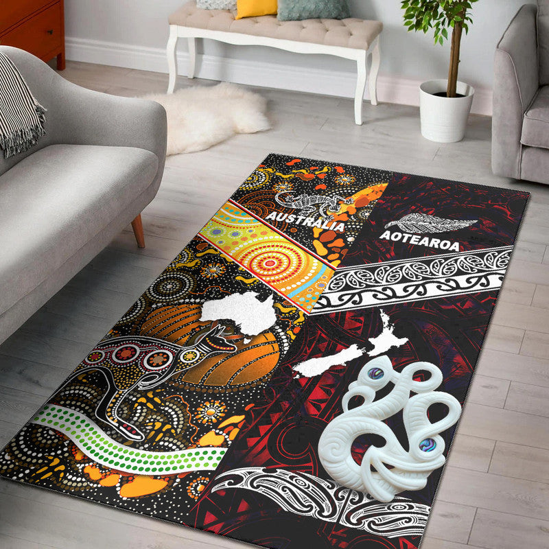 Red and black area rug with Australia & Aotearoa text, white animal silhouettes, tribal motifs