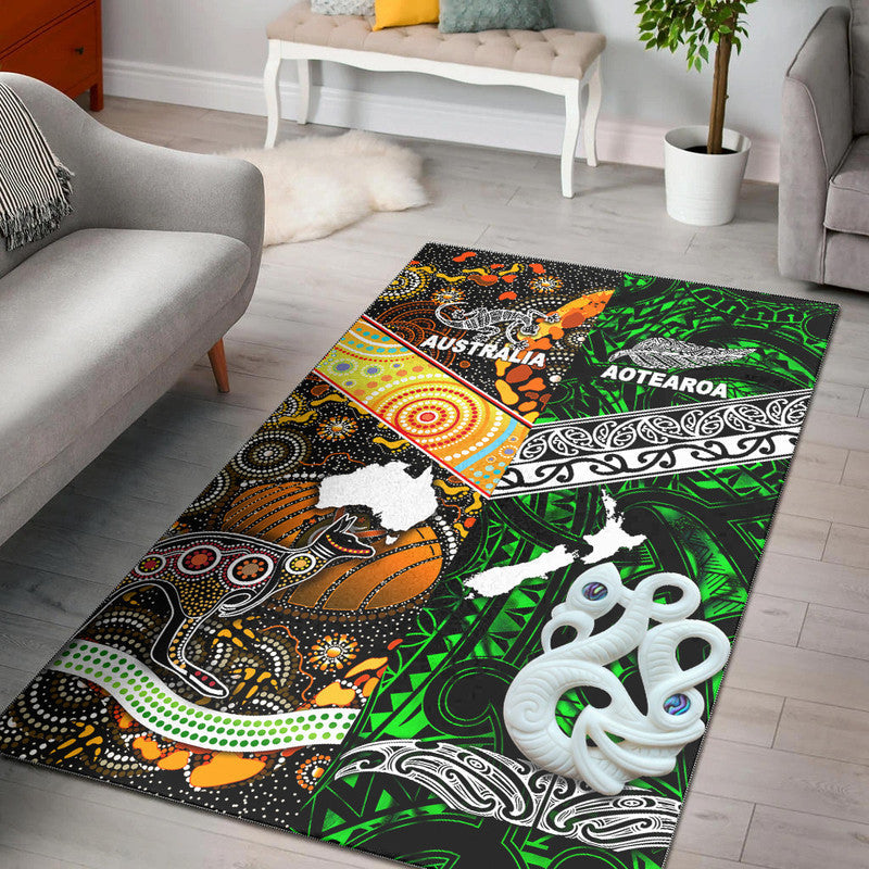 Green rug with black/white motifs and bold 'AUSTRALIA' and 'AOTEAROA' text, animals