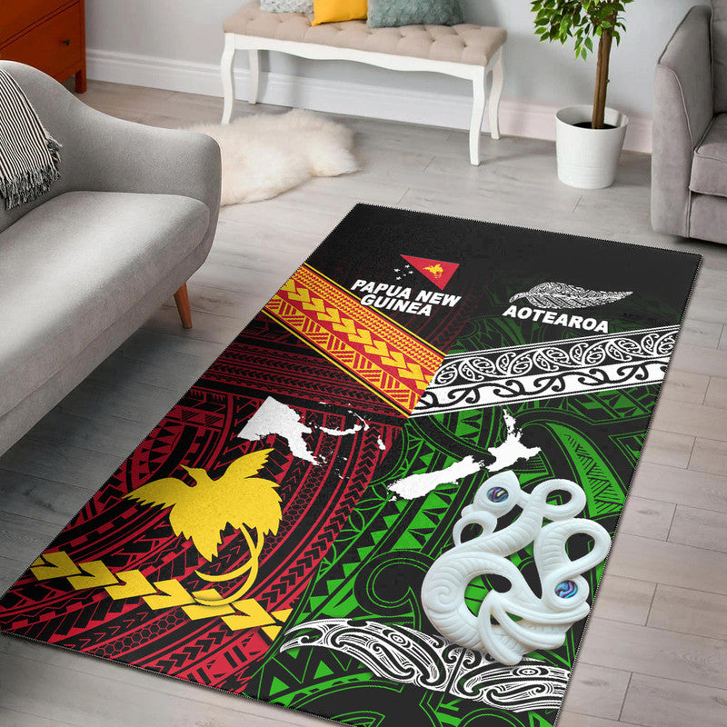 Green tribal area rug on black with white island silhouettes and red/yellow detailing