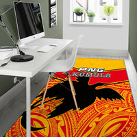 PNG KUMULS rug in office corner, yellow-red border, black bird silhouette, decorative tribal print