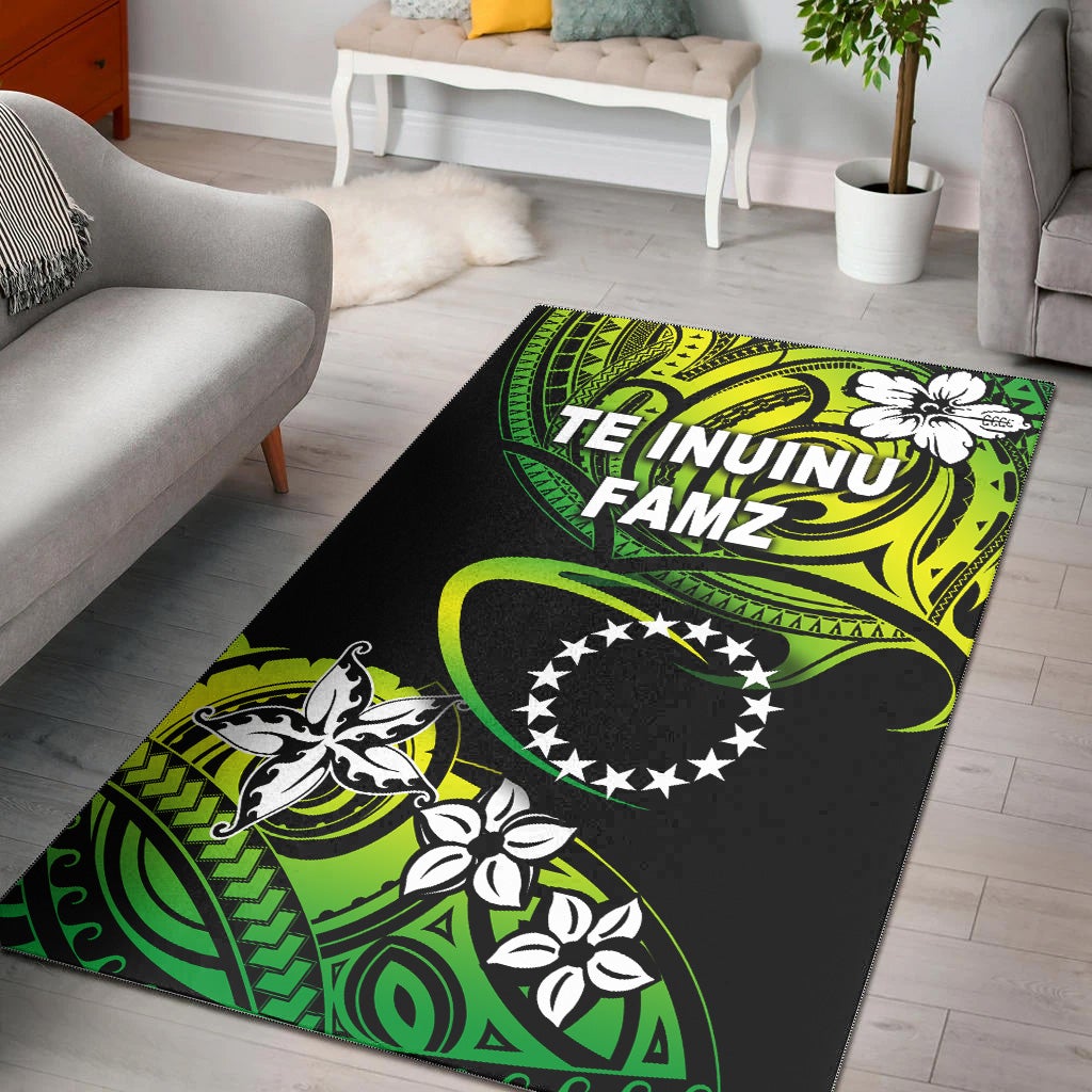 Green and black area rug with bold tribal-style graphics, stars emblem, and floral motifs