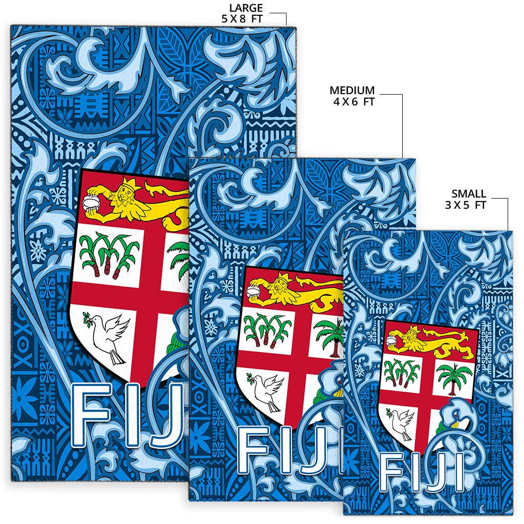 Fiji blue tapa rugs shown in 5x8, 4x6, and 3x5 sizes with FIJI text and flag cross.