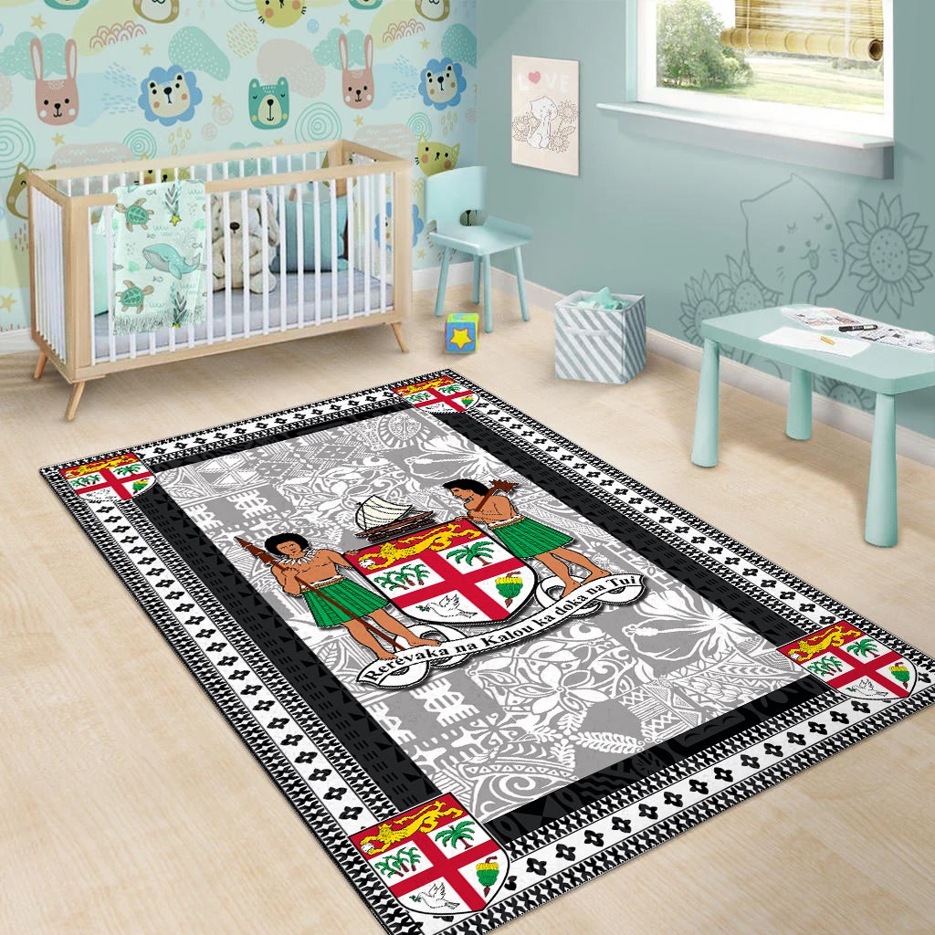 Black-bordered area rug with white-gray pattern, central island figures, and crest medallion