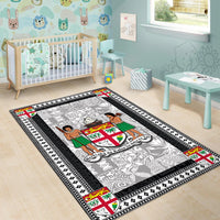 Black-bordered area rug with white-gray pattern, central island figures, and crest medallion