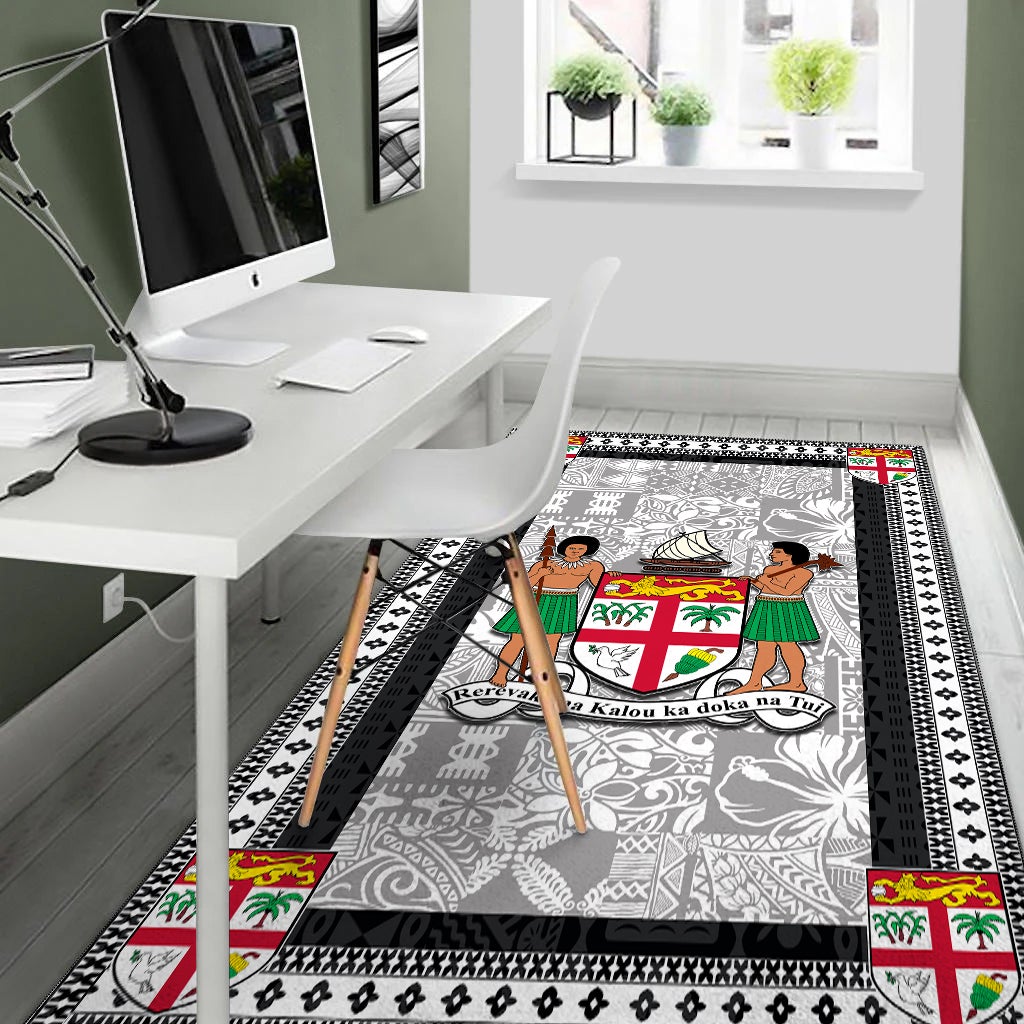 Gray area rug with black geometric border, colorful crest details at the corners