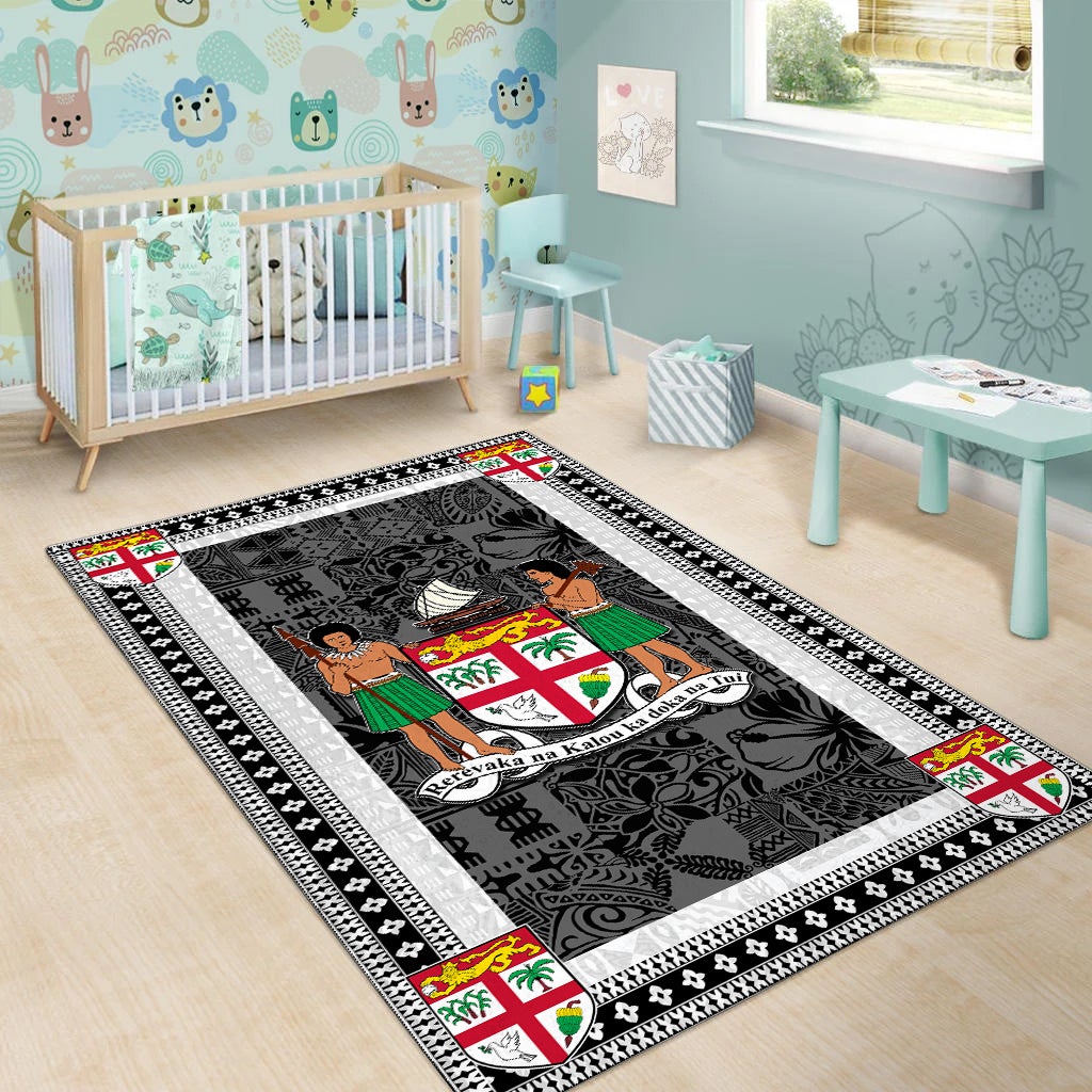 Fiji area rug in nursery, dark charcoal field with white border and colored motif corners