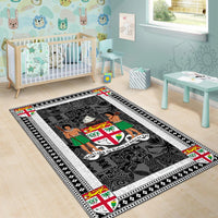 Fiji area rug in nursery, dark charcoal field with white border and colored motif corners