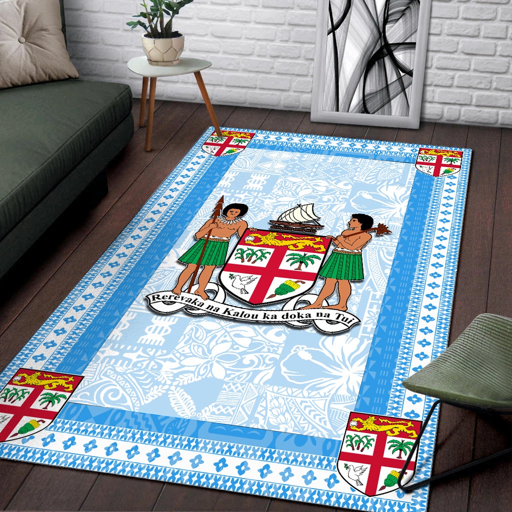 Blue Fiji area rug with two figures and canoe motif, ornate blue border