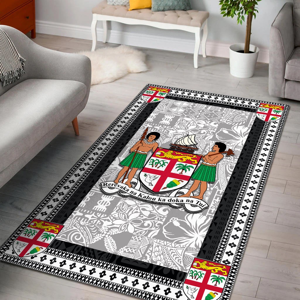 Black-bordered area rug with gray patterned center and colorful island crest motifs
