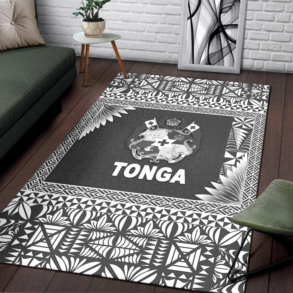 Black Tonga rug with white botanical and geometric border framing central crest