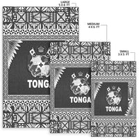 Set of black Tonga rugs in large, medium and small sizes, crest logos and borders
