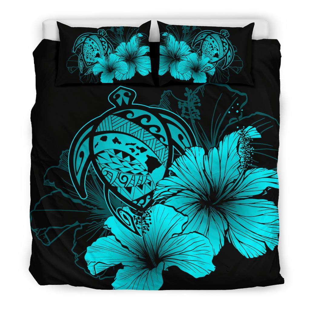 Black duvet with turquoise tribal mask, hibiscus flowers, and two matching pillow shams