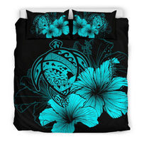 Black duvet with turquoise tribal mask, hibiscus flowers, and two matching pillow shams