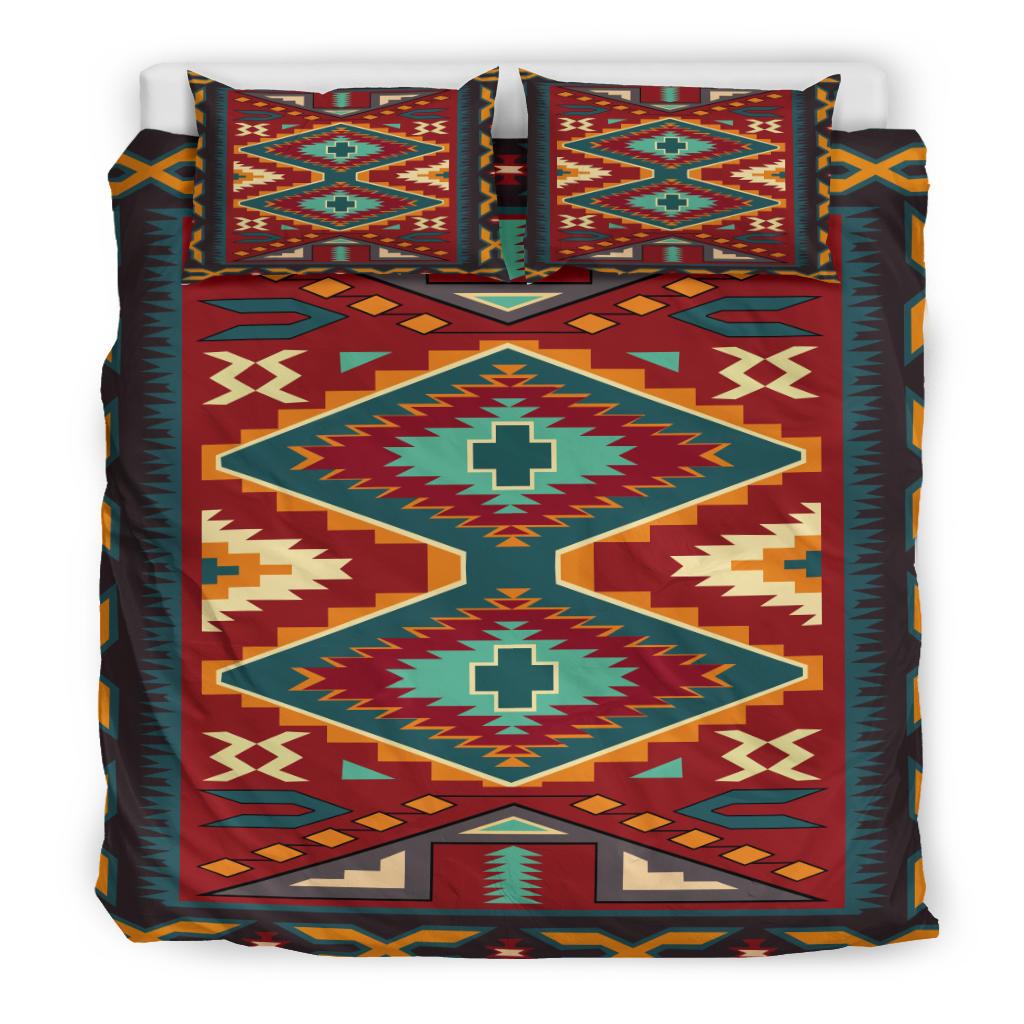 Red geometric bedding set view with pillow cases; teal cross motifs and multicolor trim
