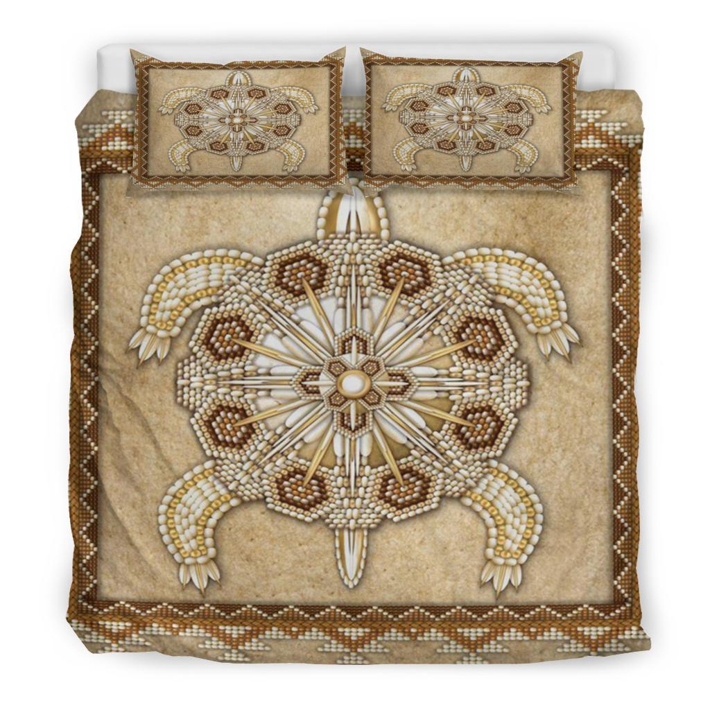Tan bedding set front view with beaded turtle mandala centerpiece and two decorative pillows