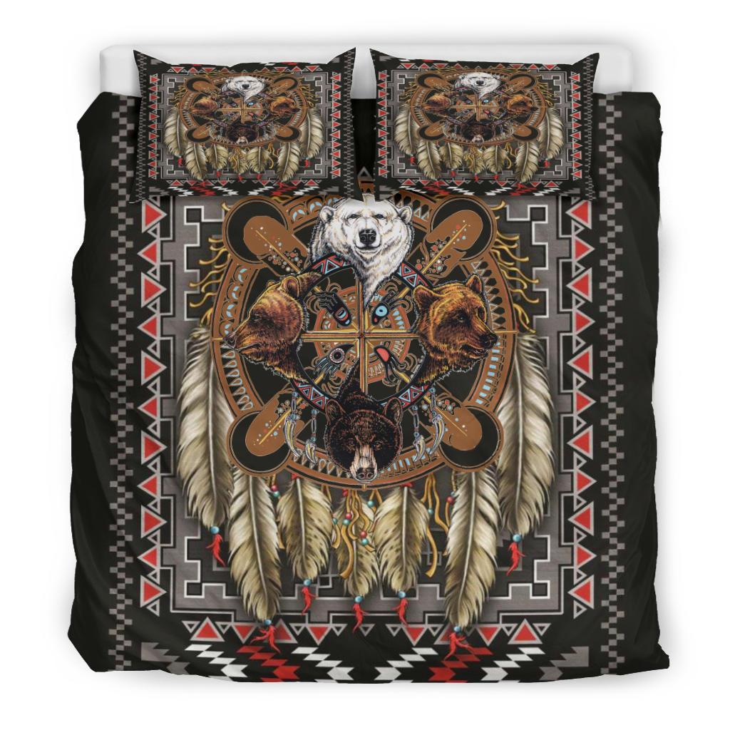 Bedding set front view: black duvet with bear totem, geometric border and feather fringe