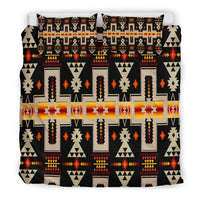 Black duvet cover with multicolor geometric Native-inspired pattern and two stacked pillows