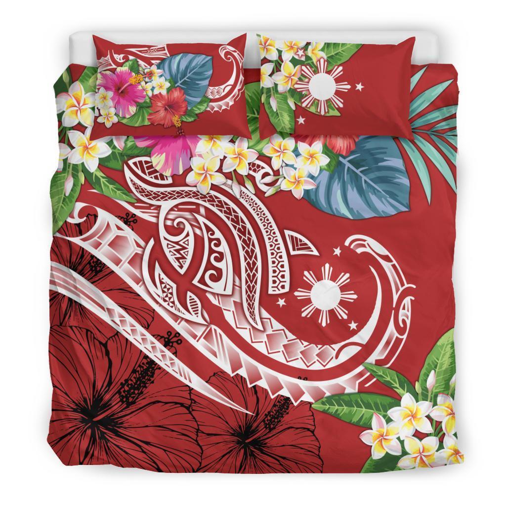 Close view red tropical duvet cover with hibiscus and plumeria flowers; two pillow shams