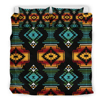 Black geometric duvet set with bold diamond and sunburst motifs in teal, red, orange, yellow