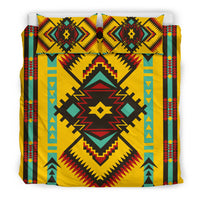 Geometric bedding set featuring two yellow-backed pillows with teal, red, and black motifs