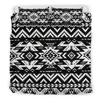 Flat view of black and white Native American style bedding set with bold geometric motif