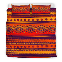Orange bedding set with two pillowcases and duvet featuring zigzag and diamond geometric bands