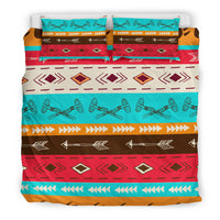 Multicolor duvet cover with turquoise top band, red diamond motifs, and arrow stripes
