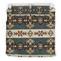 Teal bedding with centered medallion and symmetrical Navajo-inspired geometric borders.