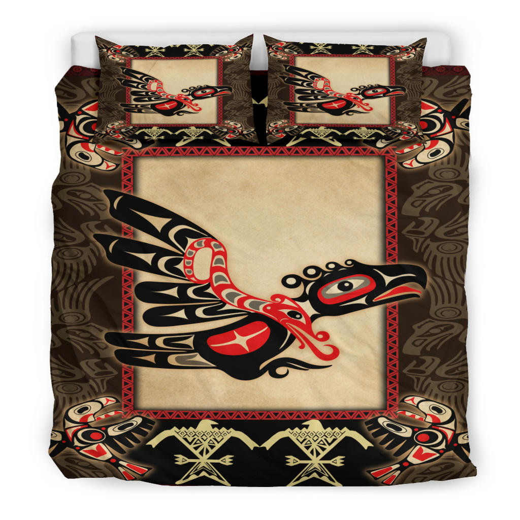 Colorful Native thunderbird comforter set with cream front and black/red motif; two pillows