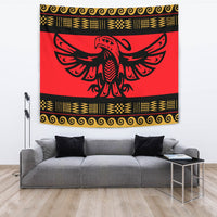 Eagle motif tapestry in red, black, and gold with patterned border, wall display