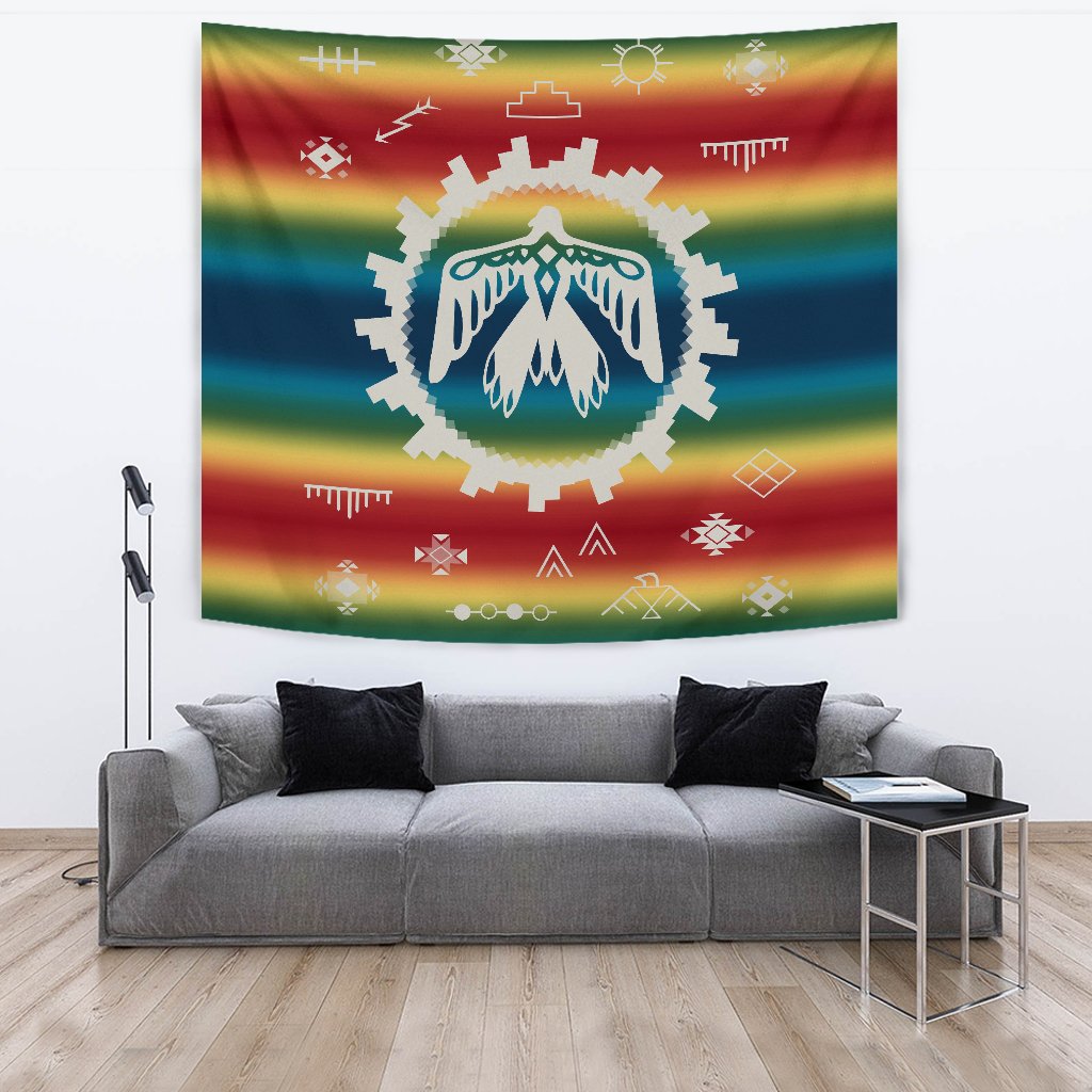 Native-style tapestry with rainbow bands and central feathered thunderbird in teal and white