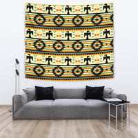 Colorful geometric tapestry featuring repeating arrowheads and star symbols
