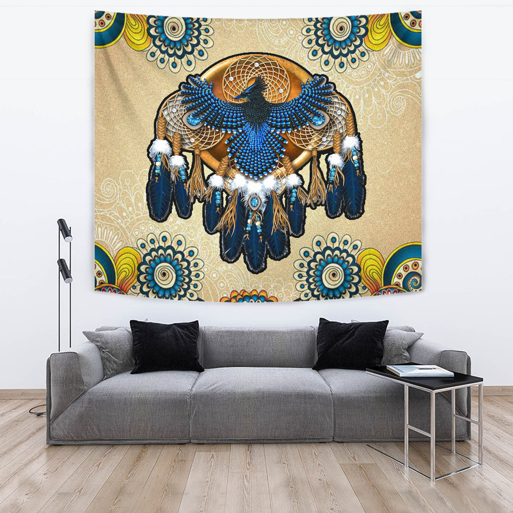 Beige wall tapestry with blue dreamcatcher centerpiece, circular web, and fringed feather detailing
