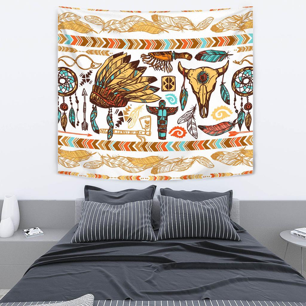 Multicolor Native American tapestry with feathers, arrows, and dreamcatcher circles above bed