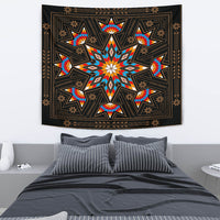 Black geometric tapestry with colorful starburst center and symmetrical diamond accents
